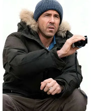 Ryan Reynolds black parka jacket from Mayday 2026